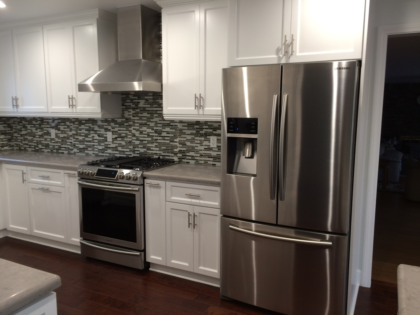 Kitchen with stainless refrigerator